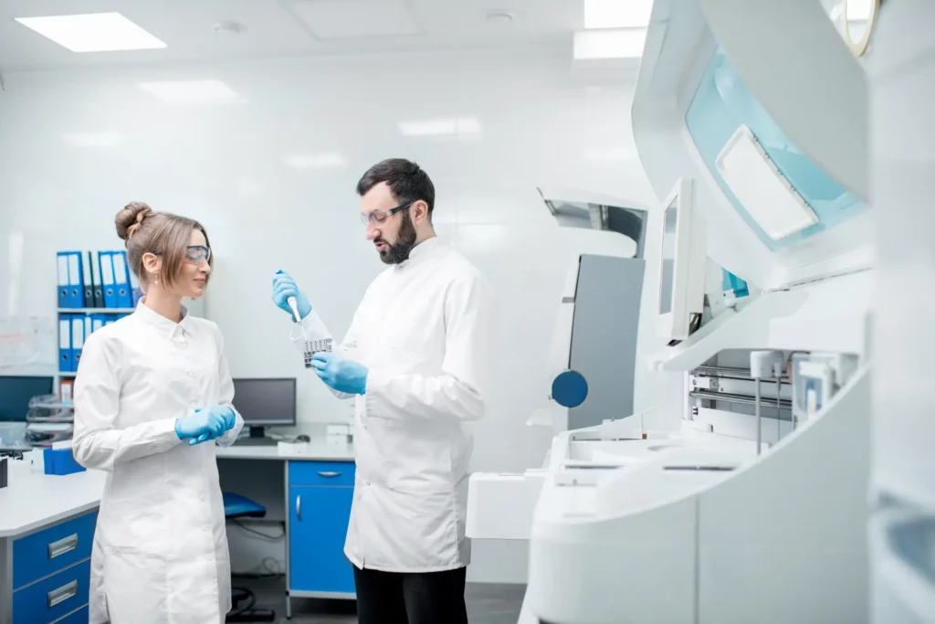 laboratory assistants workign with test tubes 2023 11 27 04 49 19 utc