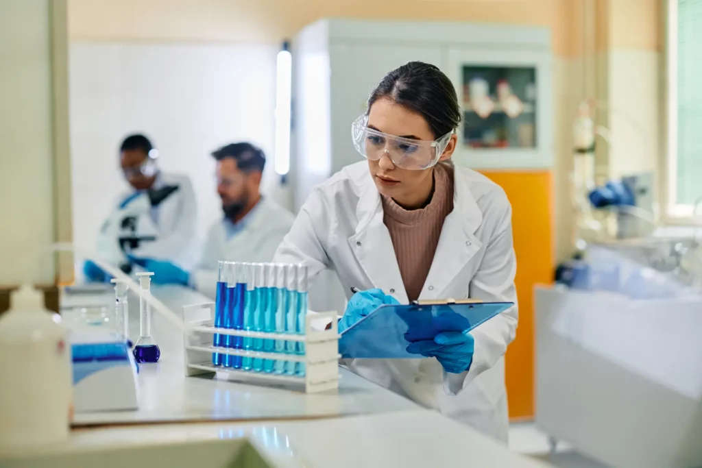 young female scientist analyzing chemical substanc 2023 11 27 05 21 45 utc